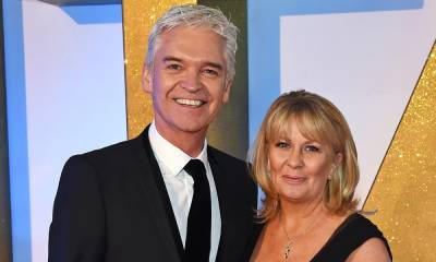 Phillip Schofield pictured with huge bunch of flowers on 28th wedding anniversary - hellomagazine.com