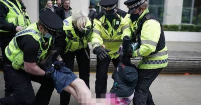 GMP launch 'urgent review' after 'uncomfortable' protest arrest that left woman exposed in her underwear - www.manchestereveningnews.co.uk - Manchester