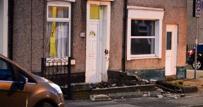 Three people injured after Audi smashes through garden wall in Heywood - www.manchestereveningnews.co.uk - Manchester