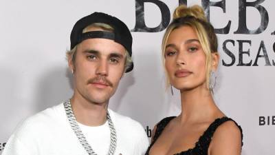 Justin Bieber and Wife Hailey Get Matching Tattoos as 'Peaches' Debuts at No. 1 on Hot 100 - www.etonline.com