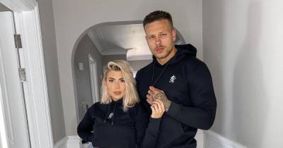 Olivia and Alex Bowen show off their stunning living area with bespoke modern art and sleek furniture - www.ok.co.uk