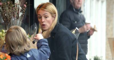 Presenter Cat Deeley looks winter chic in stylish coat as she is spotted flower shopping with son Milo - www.ok.co.uk - Britain
