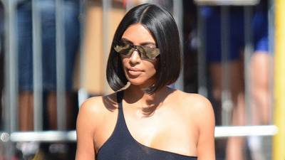 Kim Kardashian Rocks A Brown Bikini As She Snuggles With Daughter North West, 7, On A Beach - hollywoodlife.com
