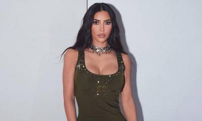 Kim Kardashian dons a green Givenchy gown to celebrate Fashion Week - us.hola.com