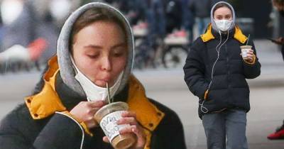 Lily-Rose Depp pulls down her mask to sneak a sip of coffee in NYC - www.msn.com - USA