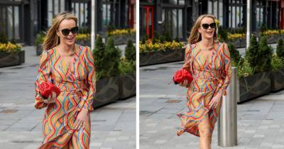 Amanda Holden risks flashing her underwear while battling the wind as she stuns in rainbow outfit - www.ok.co.uk