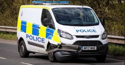 Officer injured as police van on 999 call smashes with car - www.manchestereveningnews.co.uk - Manchester