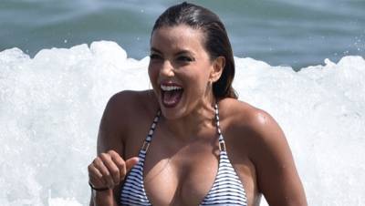 Eva Longoria, 46, Stuns In Pink Swimsuit In Throwback Vacation Pic As She Wonders If It’s ‘Bathing Suit Season’ - hollywoodlife.com