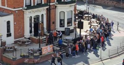 “It’s not been a great year": Punters reflect while they wait in massive queues outside pubs across Manchester... and some just want to get "really hammered" - www.manchestereveningnews.co.uk - Manchester