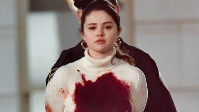Selena Gomez Is Handcuffed and Covered in Fake Blood on the Set of Her New Show - www.glamour.com