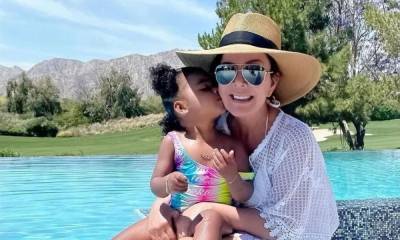 Kris Jenner, 65, looks sensational in poolside photo as she marks family celebration - hellomagazine.com