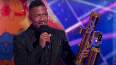 Nick Cannon Makes Explosive 'Masked Singer' Return as Host With a Clue-Firing T-Shirt Cannon (Exclusive) - www.etonline.com - Russia