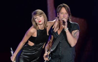 Keith Urban says he was Christmas shopping when Taylor Swift enlisted him for ‘Fearless (Taylor’s Version)’ - www.nme.com