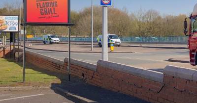 Woman taken to hospital after falling from M60 bridge in early hours - www.manchestereveningnews.co.uk
