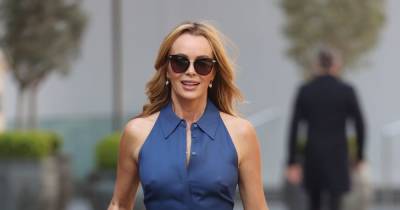 Amanda Holden goes braless and flaunts curves in chic blue jumpsuit as she soaks up sunshine - www.ok.co.uk