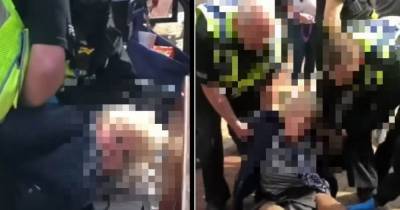 'You're breaking my arm' - police to review 'brutal' arrest of 69-year-old woman over anti-lockdown stickers - www.manchestereveningnews.co.uk - Manchester