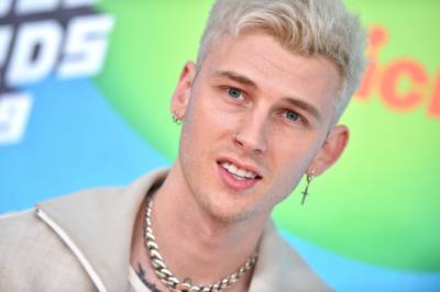 Machine Gun Kelly Gets A Tattoo That Looks Like His Throat Is Slit, And It’s Eerily Realistic - etcanada.com