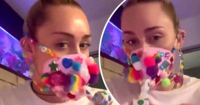 'Craft time!' Miley Cyrus fashions herself a quirky beaded face mask - www.msn.com