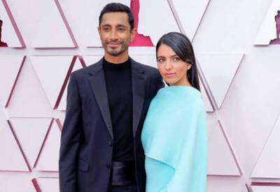Riz Ahmed fixes his wife Fatima Farheen Mirza’s hair on the Oscars red carpet: ‘Major couple goals’ - www.msn.com