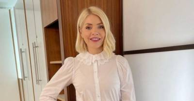 Holly Willoughby shows off amazing long legs in black mini skirt on This Morning – copy her look here - www.ok.co.uk