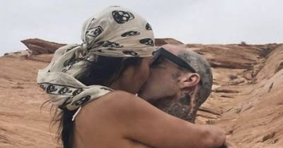 Kourtney Kardashian kisses boyfriend Travis Barker as she wears tiny thong in steamy snap - www.ok.co.uk