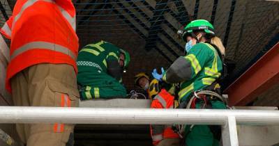 Man taken to hospital after being rescued from second floor of construction site - www.manchestereveningnews.co.uk