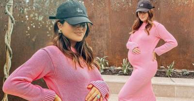 Pregnant Binky Felstead displays growing bump in a pink knitted dress - www.msn.com