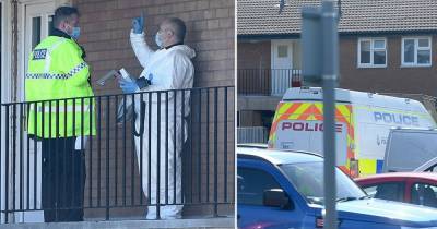 Police pictured at block of flats after woman rescued by neighbours during fire - www.manchestereveningnews.co.uk - Manchester - county Denton