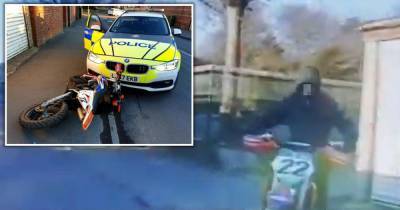 The moment traffic cops rammed balaclava-clad illegal off-road biker - before he legged it - www.manchestereveningnews.co.uk - city This