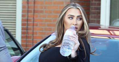 Lauren Goodger flaunts growing baby bump and shows off eye-popping derriere in skin tight jumpsuit - www.ok.co.uk