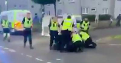 Footage shows moment violent Scots thug restrained after attacking two cops with meat cleaver - www.dailyrecord.co.uk - Scotland