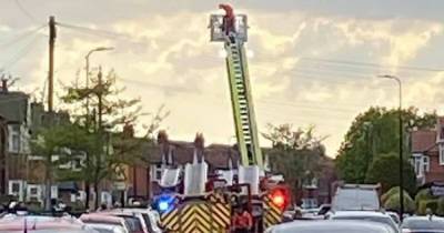 Fire crews tackle blaze in 'roof space' of two houses in Stretford - www.manchestereveningnews.co.uk