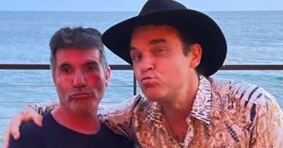 Simon Cowell shows off dramatic weight loss as he and pal Robbie Williams pout for snap - www.ok.co.uk