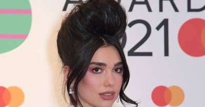 Dua Lipa looks unrecognisable with sky-high hair as she steps out on red carpet for The Brit Awards - www.ok.co.uk