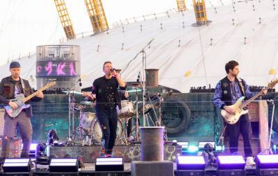 Coldplay open BRITs with performance of new single on River Thames - www.nme.com