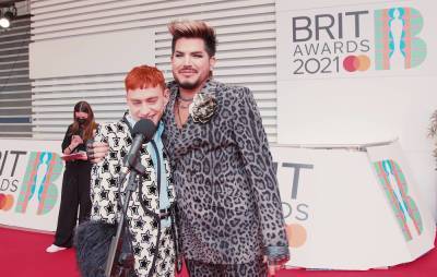 Watch Olly Alexander gatecrash our interview with Adam Lambert at the BRITs - www.nme.com
