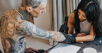 Kourtney Kardashian gets hold of tattoo gun and inks 'I love you' on smitten boyfriend Travis Barker's arm - www.ok.co.uk