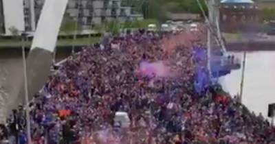 Rangers fans on march from Squinty Bridge to George Square as title revellers fill the city centre - www.dailyrecord.co.uk
