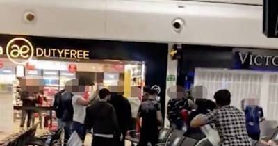 Mass brawl at airport departure lounge as holidaymaker swings suitcase and punches thrown - www.dailyrecord.co.uk