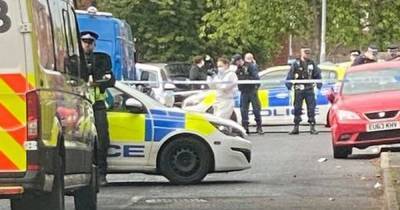 Police seal off street in north Manchester after 'gun spotted' and vehicles damaged - www.manchestereveningnews.co.uk - Manchester