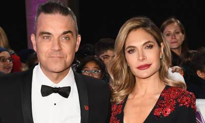 Robbie Williams is every inch the doting dad in heart-melting photo with both daughters - hellomagazine.com - Britain