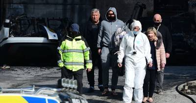 Celtic chief Peter Lawwell pictured returning to fire ravaged home to collect suitcases as probe into ‘deliberate’ blaze continues - www.dailyrecord.co.uk