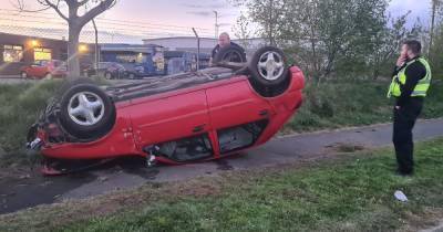 Driver has lucky escape after car flips onto its roof in Wigan crash - www.manchestereveningnews.co.uk - Manchester