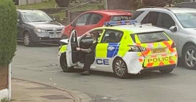Audi rams into police car 'multiple times' after man stabbed in Bolton robbery - www.manchestereveningnews.co.uk