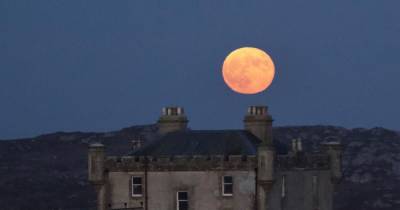 Incredible photos show giant Flower Moon rising over Scotland - www.dailyrecord.co.uk - Scotland