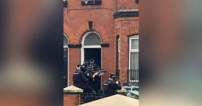 Armed police descend on street in east Manchester after 'reports of man with an axe' - www.manchestereveningnews.co.uk - Manchester