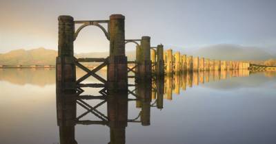 Picture Scotland: Scot captures moment of perfect calm with snap of old rail bridge that looks like a painting - www.dailyrecord.co.uk - Scotland