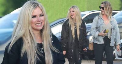 Avril Lavigne rocks a chunky black coat for dinner in Malibu with pals - www.msn.com - Malibu