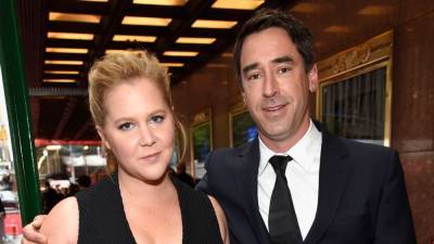 Amy Schumer Shares Emotional Post in Honor of Her Husband Chris Fischer and Son Gene - www.etonline.com