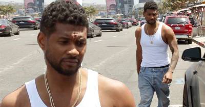 Usher plays it cool in a white tank top while on a shopping trip - www.msn.com - Las Vegas